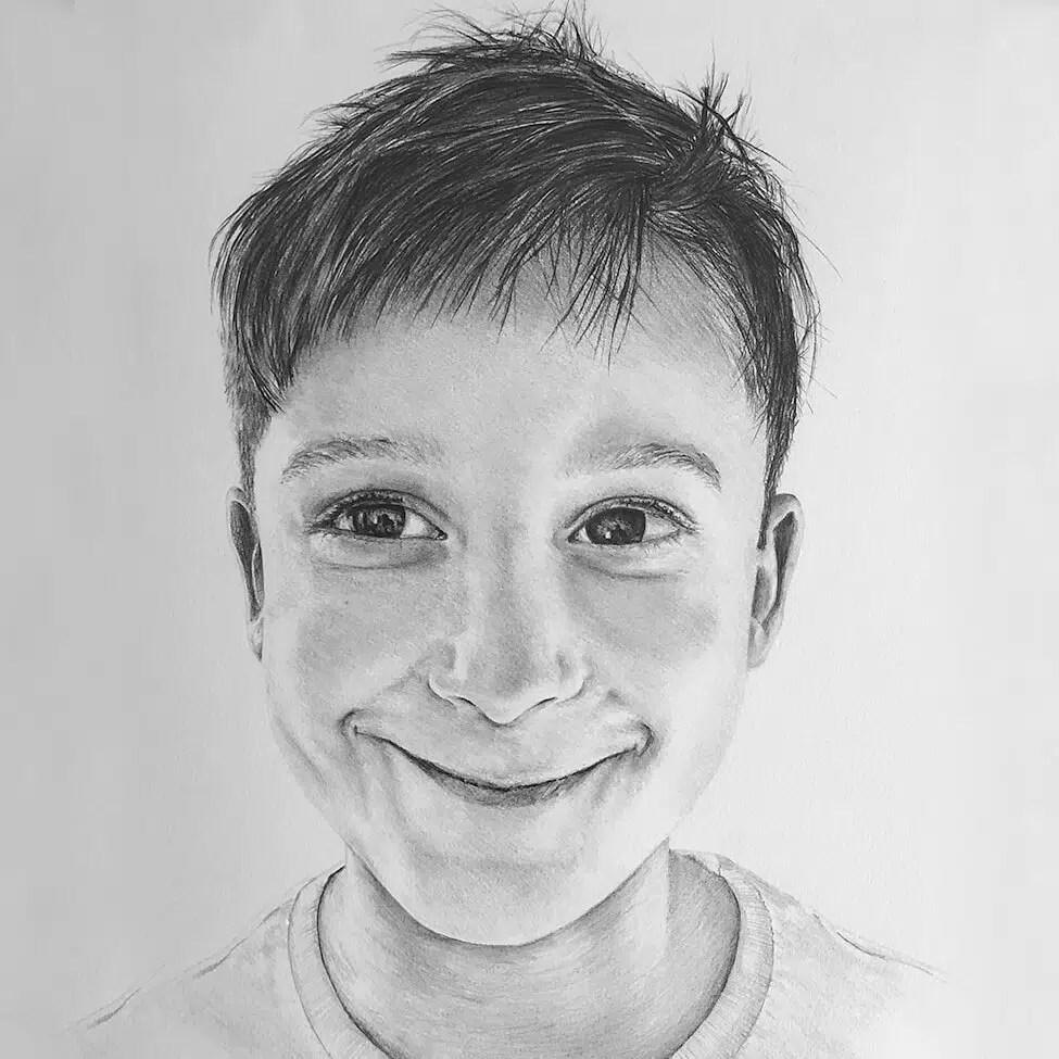 headshot of child portrait in black and white graphite pencil